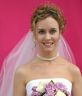 If you are looking for a curly bridal updo with headband accessory 